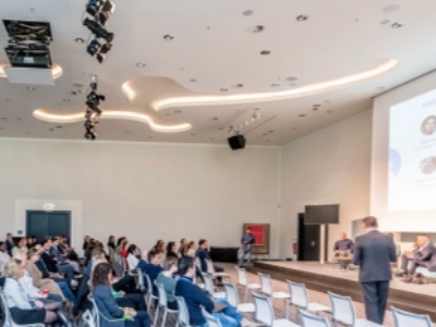Modern corporate meeting room setup at Vienna House by Wyndham Andel's Berlin with conference table and presentation screen